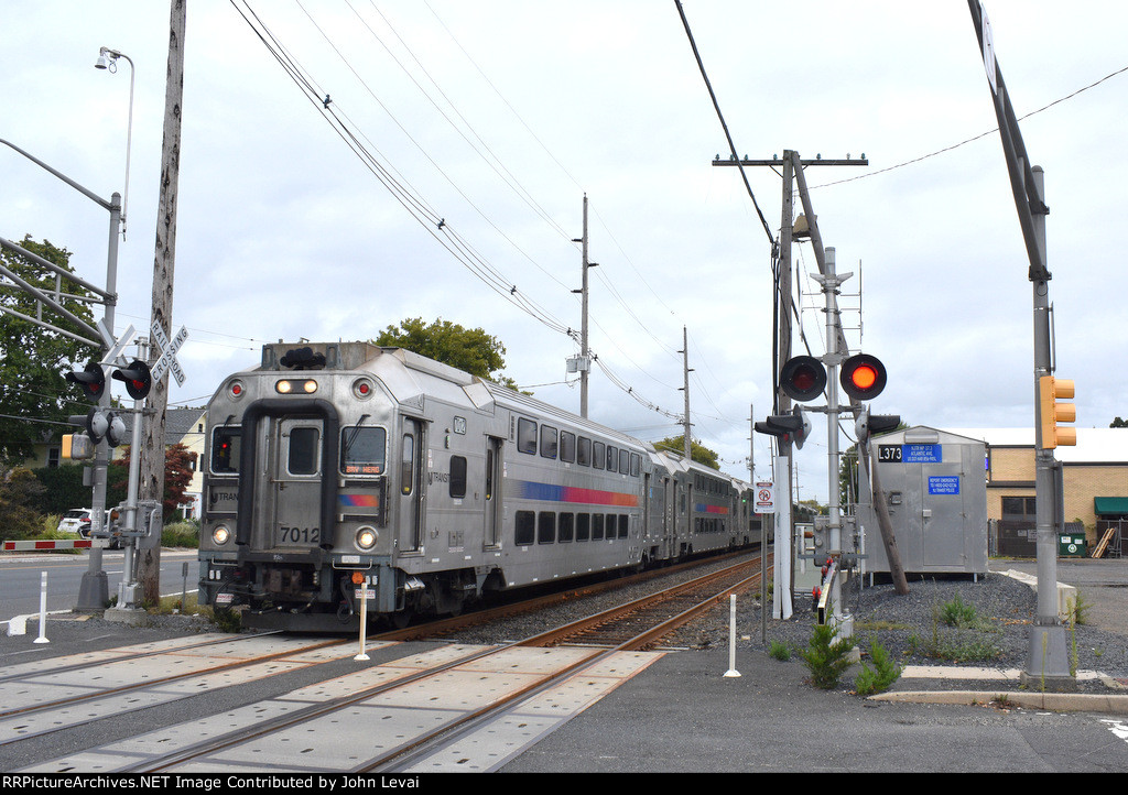 A Bay Head bound shuttle train is about to cross the Atlantic Avenue Grade Crossing in Point Pleasant Beach only a few blocks before departing PPB Station 